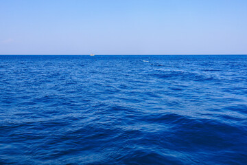 View of the open sea from the yacht. Background with selective focus