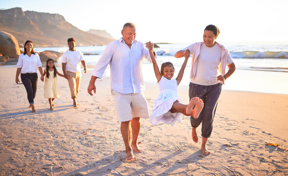 Relax, travel and happy with big family at the beach on Mexico vacation with love, support and summer. Sunset, nature and trust with grandparents, children and parents holding hands on holiday