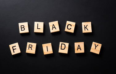 Top view of Black Friday background concept made from  wooden alphabet on black background. Shopping concept boxing day and Black Friday composition.