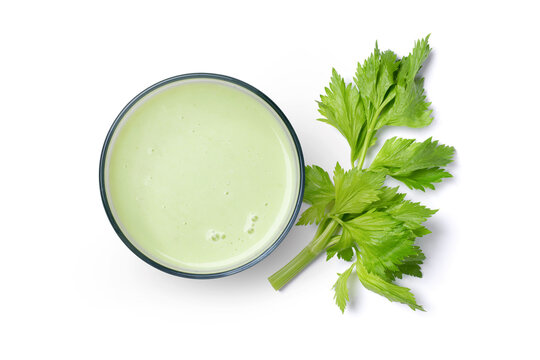Celery smoothie juice and fresh celery leaf isolated on white background.Top view, flat lay.