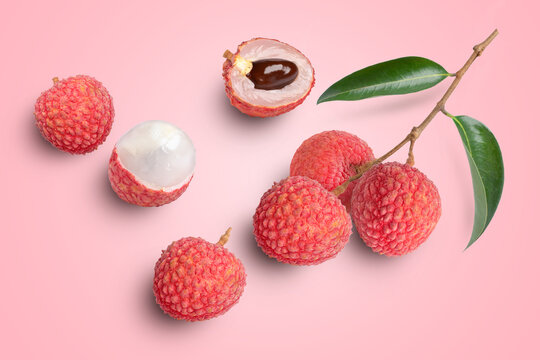 Fresh Lychee fruit and green leaf isolated on pink background, Top view, Flat lay.