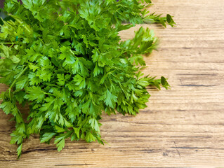 Fresh green parsley on wooden background 