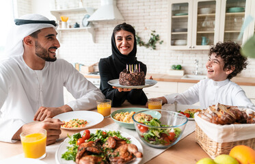 happy family from emirates eating together