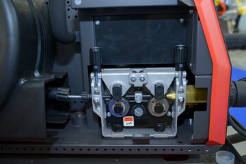 Welding wire feeder of a digital industrial semi automatic welding machine disassembled