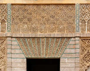Carved relief above the door in the Royal Alcazar palace in Seville, Spain