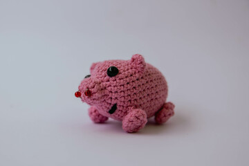knitted pink pig on a white background, mini pig, handmade, toys 