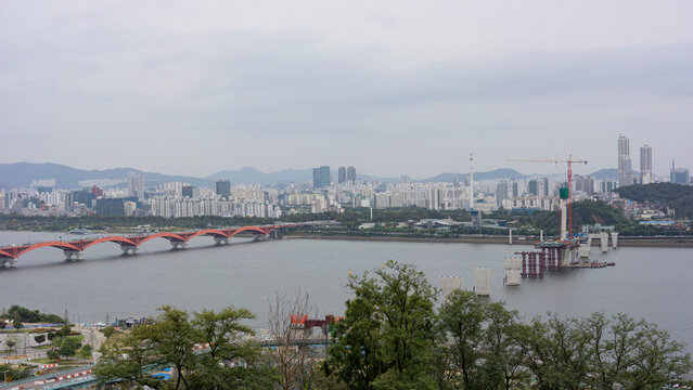 a landscape under construction of a bridge over a river