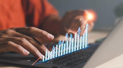 Businessman using laptop analyzing sales data graph growth on strategy modern interface icons. Digital online marketing, Solution analysis and content development on global network connectivity.