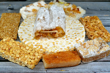 collection of Eastern candy chickpeas, peanuts, sesame, walnuts taffy, coconut and bassima as a...