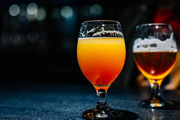 two glass of beer on table at the bar or pub