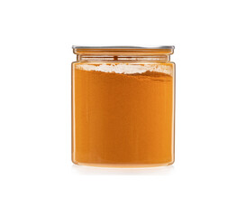 Closed jar full of ground turmeric root on a white background.