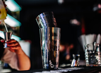 man bartender making cocktail in bar.