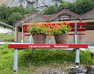 LAUTERBRUNNEN, SWITZERLAND, JUNE 22, 2022 - View of an original bench to promote the tourism in...