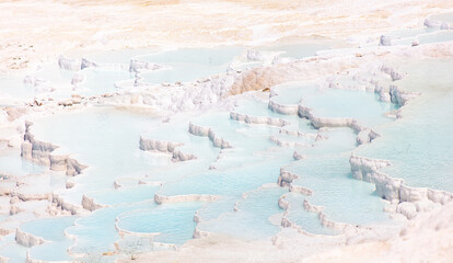 Emerald water in white limestone rock.