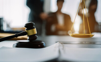 scales and auction hammer, the team meeting at the law firm behind the concept of in office law.