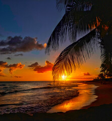 Sun slowly setting into the Caribbean Sea, Maxwell Beach, Barbados.  - obrazy, fototapety, plakaty