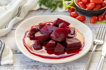 Pickled Red Beetroot. Pickled beetroot on wood background. close up