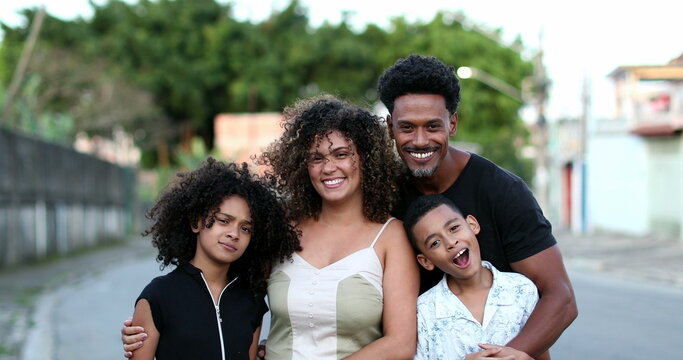 Happy African Family Portrait Standing For Photo Outside. Cheerful Black Parents And Children