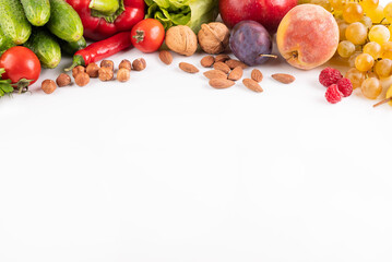 On a white background with space for writing text vegetables, fruits and nuts.