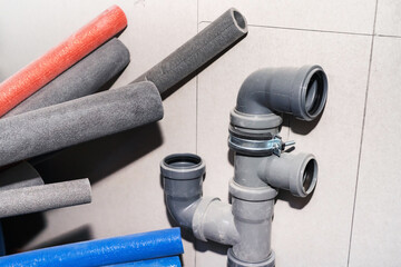 Plastic pipes for the installation of the sewer system. Prepared parts for the installation of the pipeline. Close-up