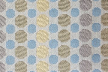 Closeup shot of a spotted patterned fabric textile surface