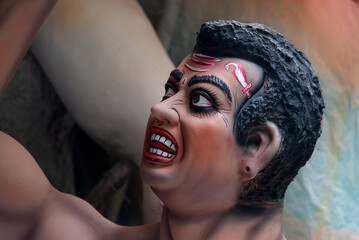 Close up of a painted face of Mahisasur or the buffalo demon face with use of selective focus
