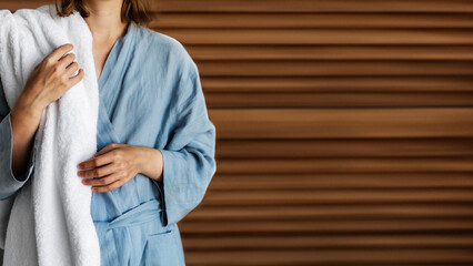 woman in a bathrobe with a towel in her hands. Woman before or after spa treatments. ?opyspace - obrazy, fototapety, plakaty