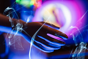 3D rendering of robot hand amidst smoke