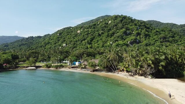 Santa Marta Colombia , Tayrona Natural Park Caribbean sea Cabo San Juan  - Drone aerial view of amazing  sand beach and  forest - Tourist attraction for relax and enjoy the paradise of the ocean sea 