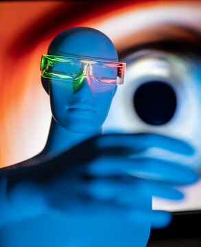 Robot with glowing futuristic smart eyeglasses in front of eye