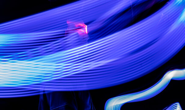 Artificial intelligence robot amidst light trail