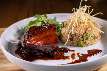 Typical peruvian food and drinks, pork belly with rice and vegetables