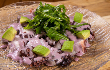 Typical peruvian food and drinks, octopus with olive tree