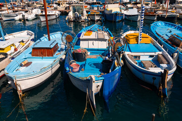 Colorful wooden fisher boats in the harbour Marina Grande on Capri Island Italy. Blue and yellow...