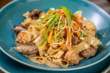 reginette pasta with meat and shrimp