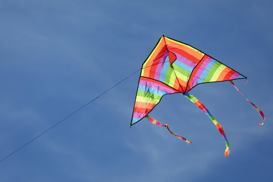 Kite with rainbow colors flying in the sky symbol of hope joy brotherhood