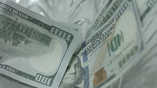 100 Dollar Bills Fall, Drop Into Crystal Bowl Close Up