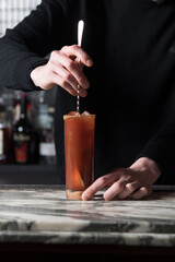 Bartender stirring a cocktail