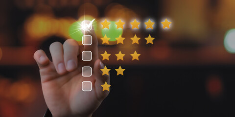 User give rating to service experience on online application for Customer review satisfaction feedback survey concept.