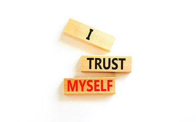 I trust myself symbol. Concept words I trust myself on wooden blocks. Beautiful white table white...