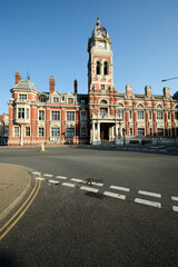 Fototapeta na wymiar Eastbourne, East Sussex/United Kingdom- July 19 2022: Exterior of Eastbourne town hall. Early morning in bright sunshine.