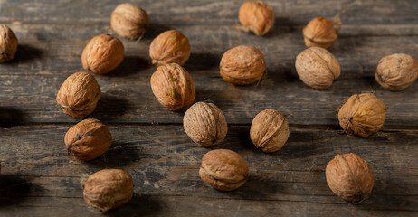 Heap of walnuts on wooden boards