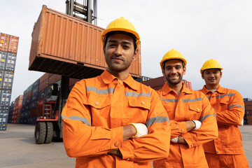 Industrial engineer smiling at the transport container, Warehousing and logistic shipping cargo concept