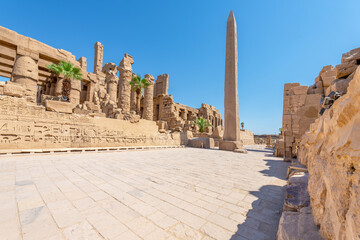 Luxor, Egypt; September 24, 2022 - A massive obelisk in the Karnak Temple - obrazy, fototapety, plakaty