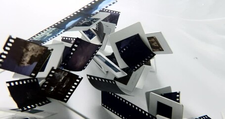 35mm film slides swimming under the water shuffling hovering spreading and moving light shines through old photos with beautiful colors waves experimental film full hd high quality