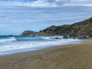 Fototapeta na wymiar Sandy beach and rocks in Alanya