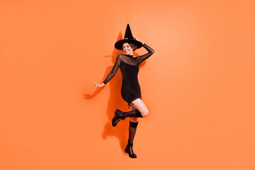 Full size photo of cute young woman have fun nightclub party dressed trendy black halloween witch...
