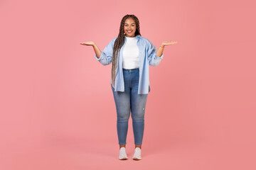 African American Lady Holding Invisible Objects On Hands, Pink Background