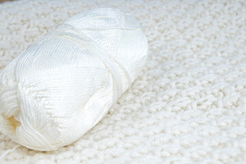 Sweater or scarf fabric texture large knitting. Knitted jersey background with a relief pattern. Wool hand- machine, handmade.