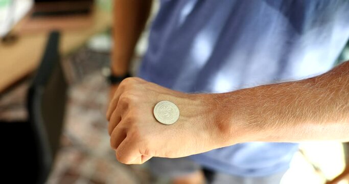 Flip coin with your hand and heads and tails